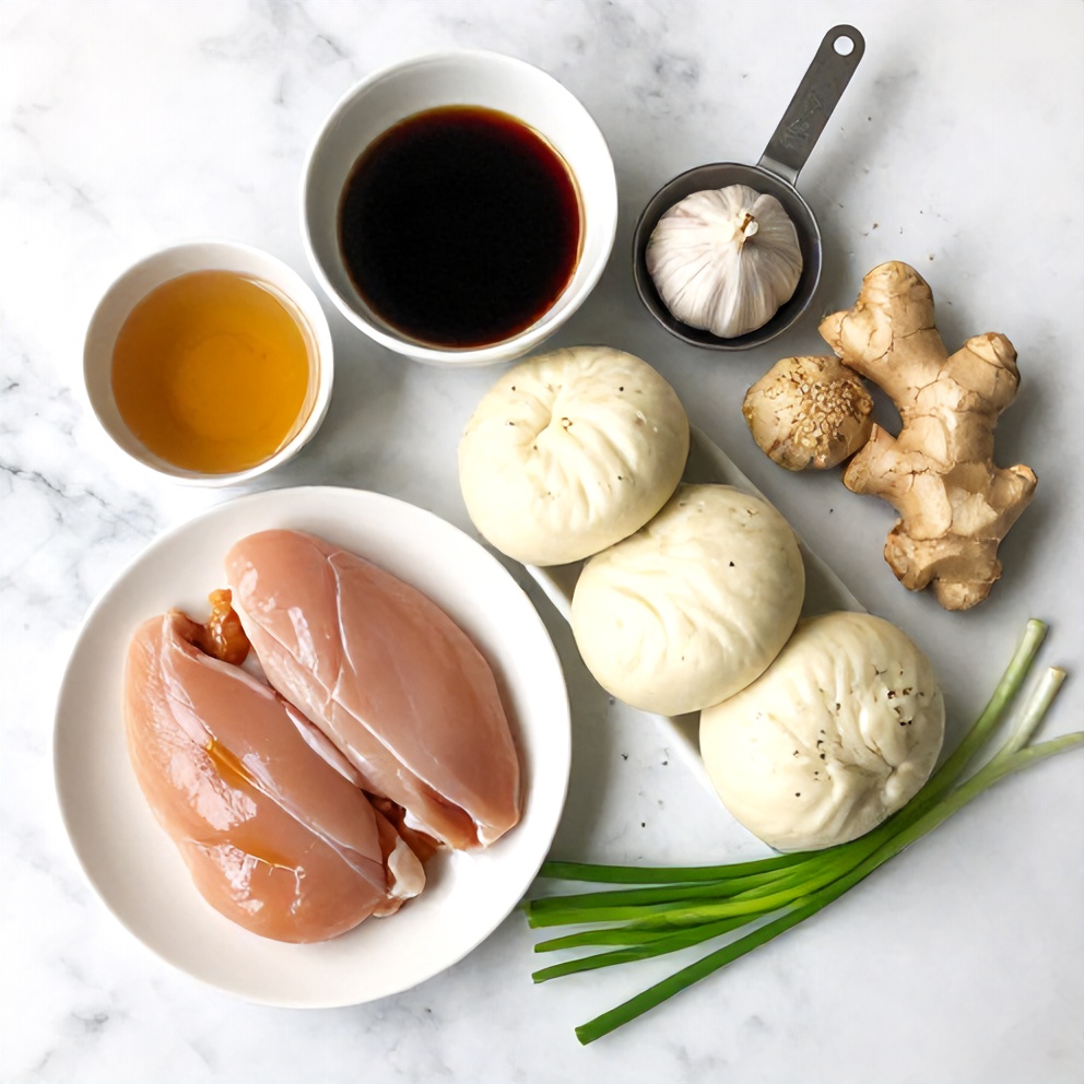 Raw ingredients for Crispy Sticky Chicken Bao Buns on a marble surface