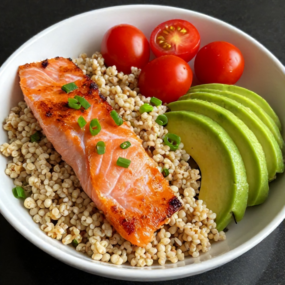 High protein smoked salmon quinoa breakfast bowls plated with avocado and cherry tomatoes